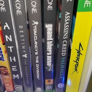 Xbox One X with controllers and games